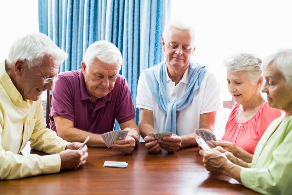 seniors playing cards together 1 scaled
